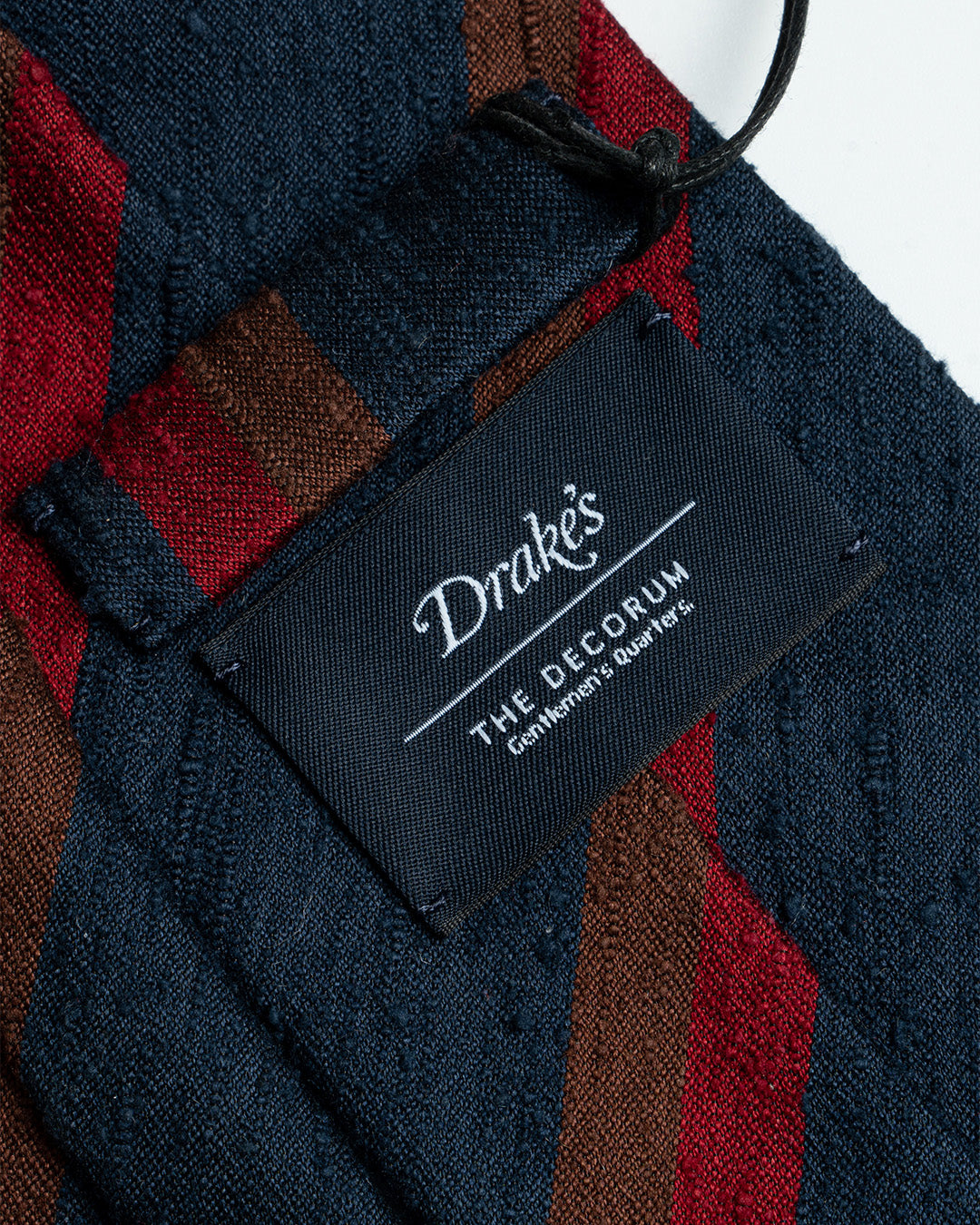 Drake’s archival tie collection for The Decorum - Red/Brown stripe